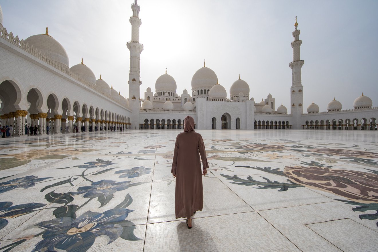 Muslim girl in the White Mosque, United Arab Emirates